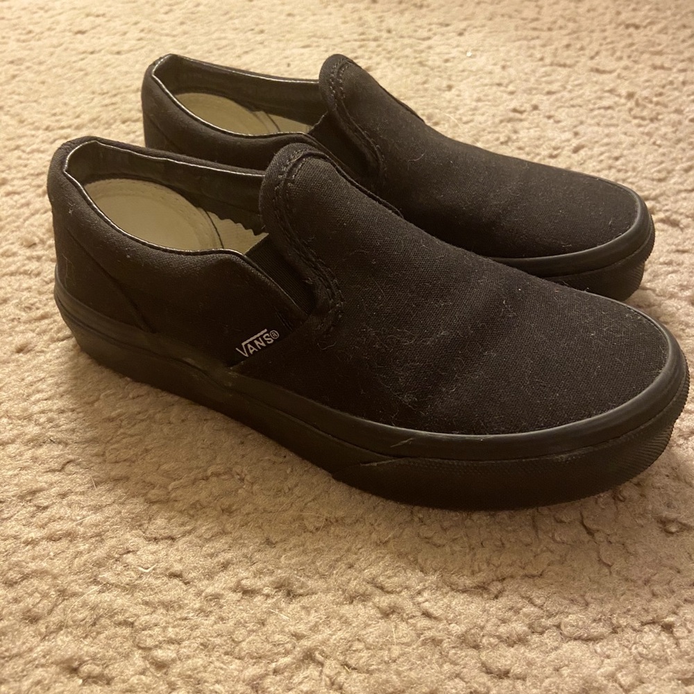 Kids slip on all black Vans